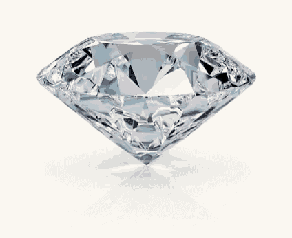 Un diamant taille brillant tournant lentement sur son axe