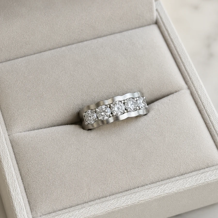 The finished five-stone wedding band in its presentation box
